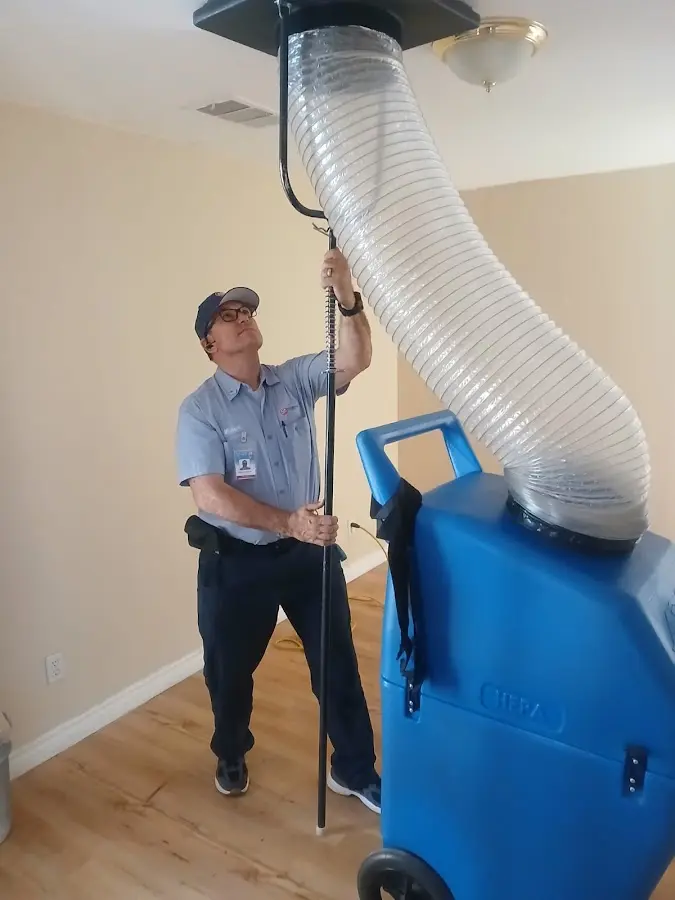 Furnace Tune-Up technician using HEPA equipment in Statesboro